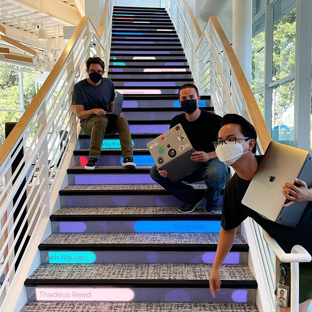 Googlers Working At Google On The Staircase With Masks